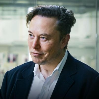 He is on a suit and has a serious look on his face.